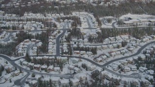 AK0001_0749 - 4K aerial stock footage snowy residential neighborhood, Eagle River Valley, Eagle River, Alaska
