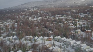 AK0001_0750 - 4K aerial stock footage snowy residential neighborhood, Eagle River Valley, Eagle River, Alaska