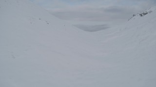 AK0001_0769 - 4K aerial stock footage snowy ridge, Knik Arm of the Cook Inlet, Palmer Slough, Chugach Mountains, Alaska