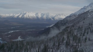 AK0001_0780 - 4K aerial stock footage approaching Knik River Valley, near snowy Chugach Mountains, Alaska