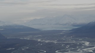 AK0001_0789 - 4K aerial stock footage Knik Glacier, snowy Chugach Mountains, Swan Lake, Knik River Valley, Alaska