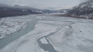 AK0001_0855 - 4K aerial stock footage flying over icy Matanuska River Valley, Alaska