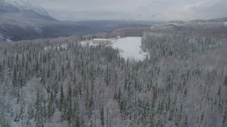 AK0001_0863 - 4K aerial stock footage descend toward snowy runway, King Ranch, Sutton, Alaska
