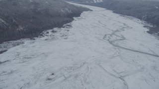 AK0001_0867 - 4K aerial stock footage flying over the snow-covered The Matanuska River Valley, Alaska
