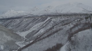 AK0001_0884 - 4K aerial stock footage video fly over gorge near the snow-covered Chugach Mountains, Alaskan Wilderness
