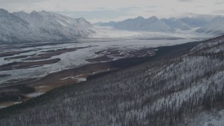 AK0001_0892 - 4K aerial stock footage approaching glacier at end of the snow covered Tazlina River Valley, Alaska