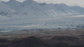 AK0001_0914 - 4K aerial stock footage approaching snow-covered Chugach Mountains, Tazlina Glacier, Alaska