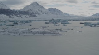 AK0001_0916 - 4K aerial stock footage flying over glacial ice, toward edge of snow covered glacier during winter, Tazlina Lake, Alaska