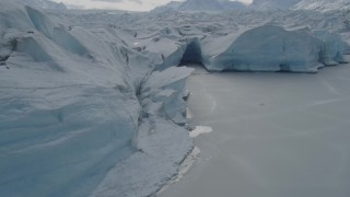 AK0001_0920 - 4K aerial stock footage flying over the edge of snow covered Tazlina Glacier, Alaska