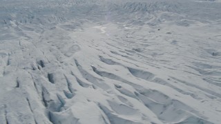 AK0001_0924 - 4K aerial stock footage flying over snow covered surface of the Tazlina Glacier, Alaska