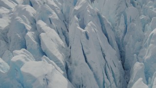 AK0001_0930 - 4K aerial stock footage flying over snow covered surface of the Tazlina Glacier, Alaska