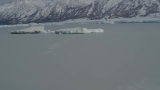 AK0001_0940 - 4K aerial stock footage fly over glacial ice toward snow covered Tazlina Glacier, during winter, Tazlina Lake, Alaska