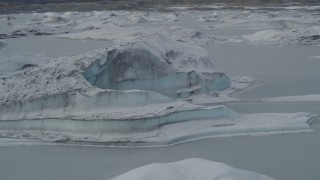 AK0001_0949 - 4K aerial stock footage flying over snow covered glacial ice during winter, Tazlina Lake, Alaska