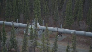 AK0001_0979 - 4K aerial stock footage orbiting station along pipeline, during winter, Trans-Alaska Pipeline, Alaska