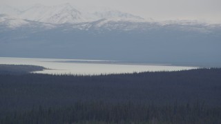 AK0001_1027 - 4K aerial stock footage the Tazlina Lake at the base of the snow covered Chugach Mountains, Alaska