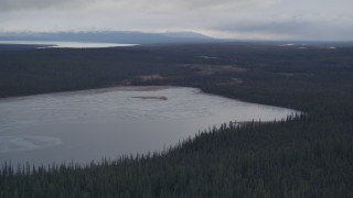 AK0001_1028 - 4K aerial stock footage flying over a small lake towards Tazlina Lake, Alaska