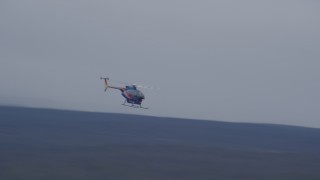AK0001_1034 - 4K aerial stock footage tracking a helicopter, Alaskan Wilderness