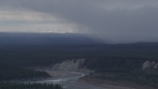 AK0001_1041 - 4K aerial stock footage flying over forest near a canyon and the Tazlina River, Alaska
