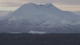 AK0001_1050 - 4K aerial stock footage a snow covered Talkeetna Mountain peak, Alaskan Wilderness