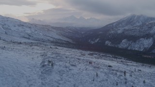 AK0001_1063 - 4K aerial stock footage flying over snowy slopes, Talkeetna Mountains, Alaska