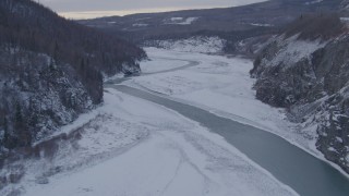 AK0001_1084 - 4K aerial stock footage fly over the Matanuska River and snowy Matanuska River Valley, Alaska