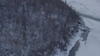 AK0001_1085 - 4K aerial stock footage tilt from a bird's eye view of the snow covered Matanuska River Valley, Alaska