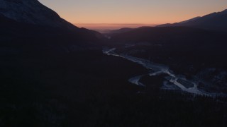 AK0001_1109 - 4K aerial stock footage flying over the snow covered Matanuska River Valley at sunset, Alaska