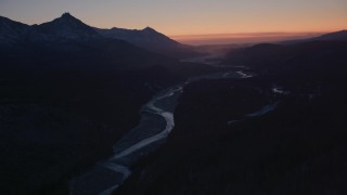 AK0001_1114 - 4K aerial stock footage flying over the snow covered Matanuska River Valley at sunset, Alaska