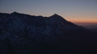 AK0001_1124 - 4K stock footage aerial video flying toward snow covered Chugach Mountains at twilight, Alaska