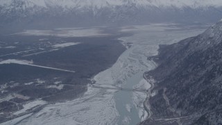 AK0001_1212 - 4K stock footage aerial video Old Glenn Highway bridge, snowy Knik River Valley near Butte, Alaska