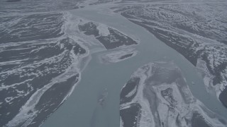 AK0001_1216 - 4K aerial stock footage flying over Knik River in snow covered Knik River Valley, Alaska