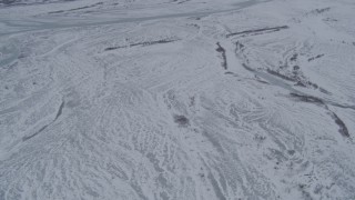 AK0001_1230 - 4K aerial stock footage flying over snowy Knik River Valley, Alaska