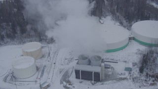 AK0001_1322 - 4K aerial stock footage a snow covered power plant, Anchorage, Alaska