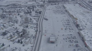 AK0001_1325 - 4K aerial stock footage follow Penland Parkway to reveal snowy Merrill Field, Anchorage, Alaska