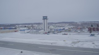 AK0001_1328 - 4K aerial stock footage the Merrill Field control tower in snow, Anchorage, Alaska