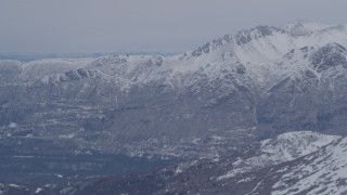 AK0001_1343 - 4K aerial stock footage the snow covered Chugach Mountains near Eagle River, Alaska
