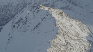 AK0001_1373 - 4K aerial stock footage snowy mountain ridge, revealing Knik River Valley, Chugach Mountains, Alaska