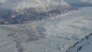 AK0001_1380 - 4K aerial stock footage Knik River Valley, Knik Glacier, Chugach Mountains, Alaska in snow