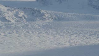 AK0001_1398 - 4K aerial stock footage the snow covered Knik Glacier spilling down the Chugach Mountains, Alaska