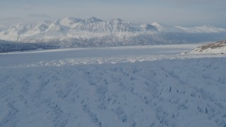 AK0001_1405 - 4K aerial stock footage the snow covered Knik Glacier and Chugach Mountains, Alaska