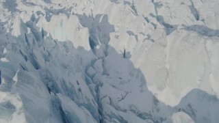 AK0001_1417 - 4K aerial stock footage the jagged, snow covered surface of the Knik Glacier, Alaska