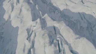 AK0001_1418 - 4K aerial stock footage the ridged, snow covered surface of the Knik Glacier, Alaska