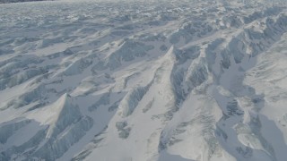 AK0001_1422 - 4K aerial stock footage the ridged, snow covered surface of the Knik Glacier, Alaska