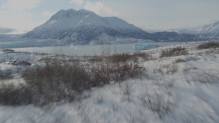 AK0001_1432 - 4K aerial stock footage video flying over the snow covered Knik Glacier revealing Inner Lake George, Alaska