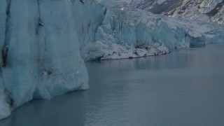 AK0001_1449 - 4K aerial stock footage the edge of a snow covered glacier on Inner Lake George, Alaska