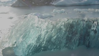 AK0001_1461 - 4K aerial stock footage flyby blue glacial ice on Inner Lake George, Alaska in snow