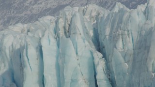 AK0001_1477 - 4K aerial stock footage approaching edge of snow covered glacier on Inner Lake George, Alaska