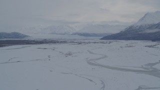 AK0001_1597 - 4K aerial stock footage Knik Glacier, Chugach Mountains seen from snowy Knik River Valley, Alaska