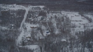 AK0001_1626 - 4K aerial stock footage a snow covered mobile home park in Chugiak, Alaska
