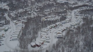 AK0001_1632 - 4K aerial stock footage approaching Eagle River, snow covered, residential neighborhoods, Alaska